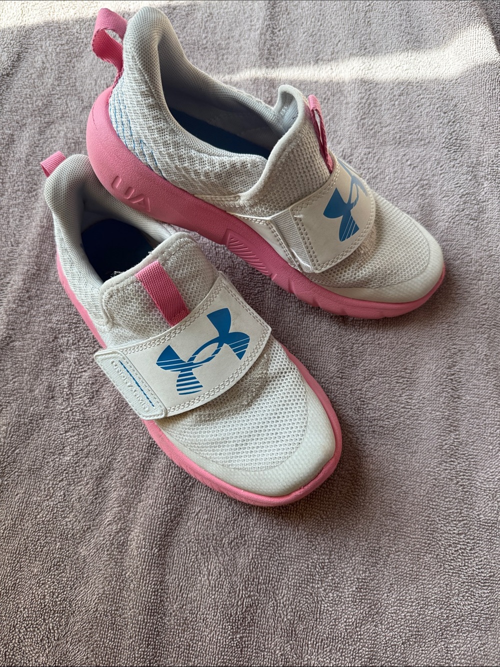 Under Armour Kids White and Pink Slip-On Sneakers with Blue Logo